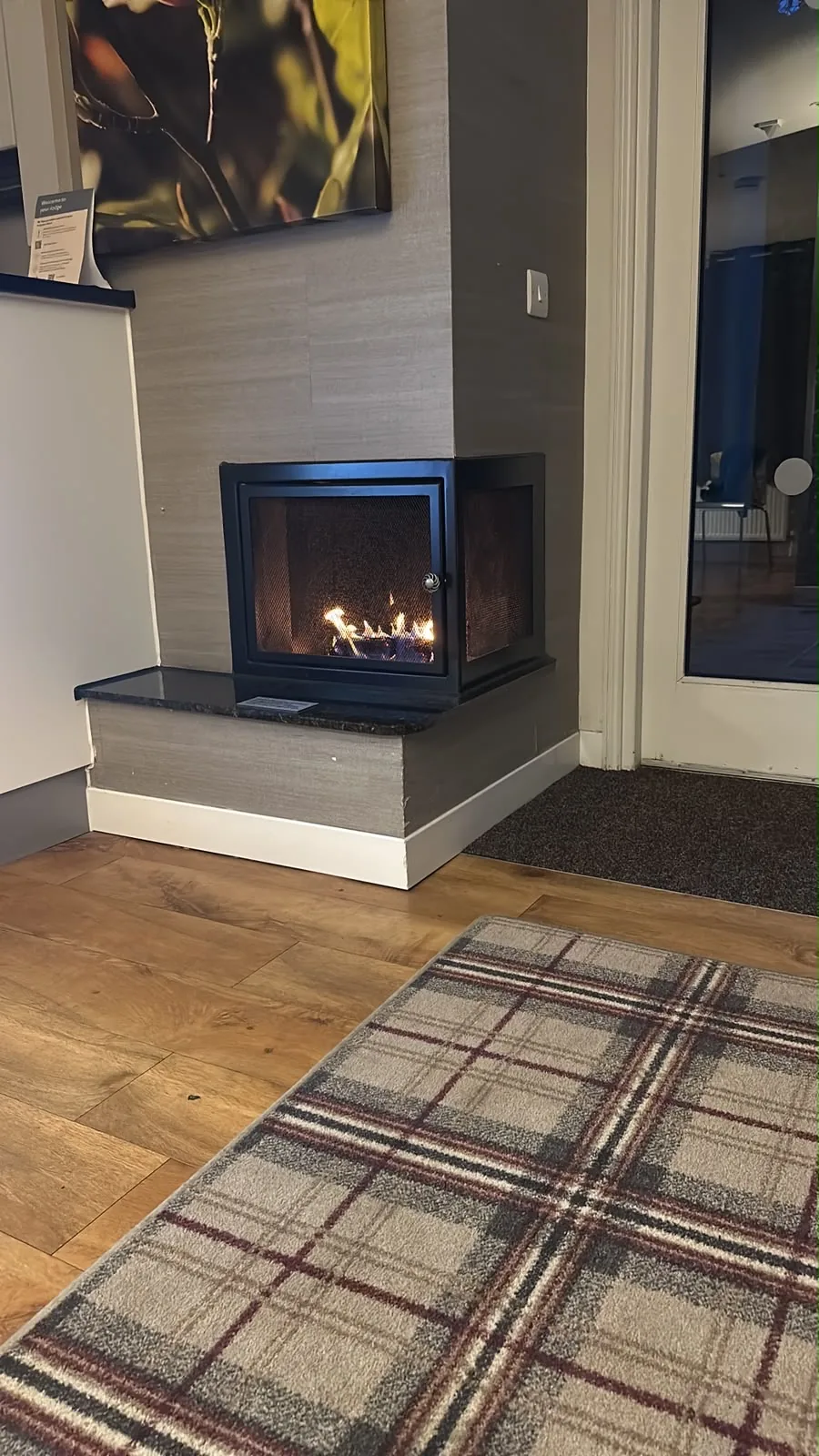 A finished living room with a modern fireplace in Cambridge